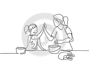 Single line drawing of mother and daughter preparing to cook some cookies at the kitchen and giving high five gesture. Parenting
