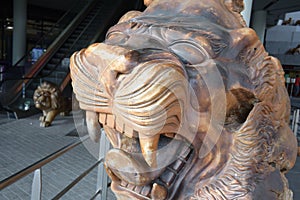 A single lion sculpture statue outside Flower Dome at Gardens by the Bay