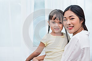 Single mom and daughter portrait. Happy family and people concept. Mother and Children day theme
