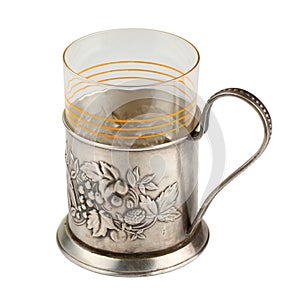 Single old metal cup holder with a glass inside isolated on a white