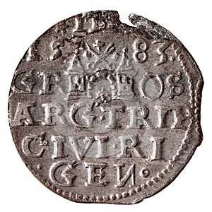 Single old silver coin 16th century isolated on white. Reverse of three groschen with Greater coat of arms of Riga