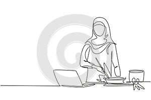 Single one line drawing Arabian woman cooking dinner has video call conversation in kitchen. Female talking with friend using