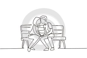 Single one line drawing kissing couple. Young man and woman face to face sitting on park bench and funny kissing. Romantic couple