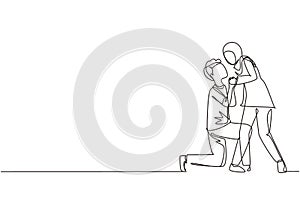 Single one line drawing romantic Arabic male kneel and kissing female. Couple lovers kissing and holding hands. Happy man and