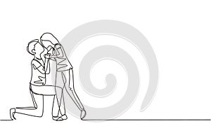 Single one line drawing romantic male kneel and kissing female. Couple lovers kissing and holding hands. Happy man and woman