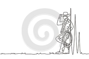 Single one line drawing western relaxing man with cowboy hat and lasso. American cowboy lifestyle at livestock horse in the