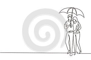 Single one line drawing young couple man woman, girl and boy walking holding umbrella under rain smiling hugging. Romantic couple
