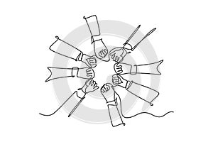 Single one line drawing of young happy people fist and join their hands together and create circle shape. Business team building