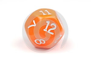 A single, orange, 12-sided die on white