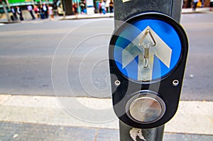 Pedestrian crossing control button at intersection. photo