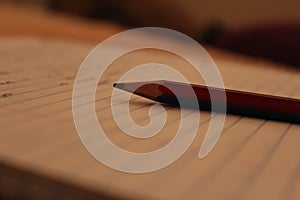 Single pencil over a scribbling pad