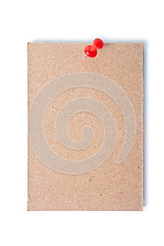 Single piece of cardboard pinned with a thumb tack with clipping path.