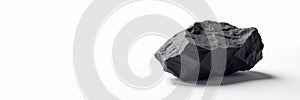 Single piece of coal on pristine white background , piece, single