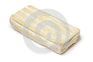 Single piece of French sheep cheese, fromage de brebis on white background photo