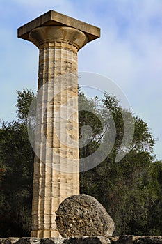 Single pillar of three from Temple of Zeus at ancient Olympia Greece reconstructed with fallen section on side at bottom