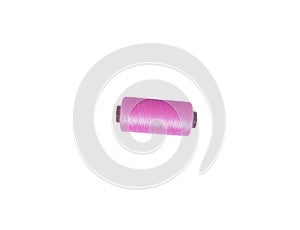 Single pink yarn on spool isolated on white background. Spool with thread without shadow