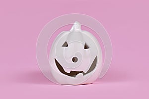 Single Pumpkin decoration with face on pink background