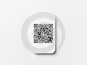 Single qr code on white card against light background