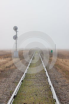 Single Railroad Track Receding into Fog