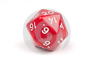 A single red 20-sided die on white