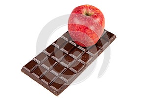 Single red apple with chocolate bar isolated in white background