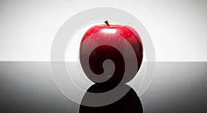 Single Red Apple Reflection on Glossy Surface