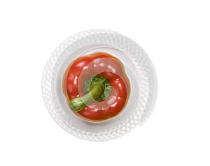 Single red bell pepper isolated on white background