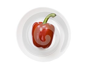 Single red bell pepper isolated on white background