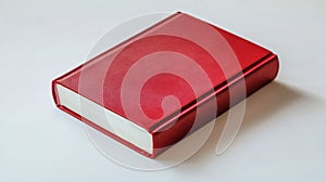 A single red book on a white surface