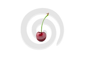 Single red cherry isolated on white background