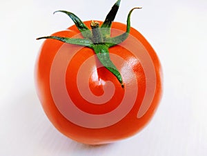 Single Red Cherry tomato fruit vine tomato vegetable 
tamaatar tomat timatar pomidor tomate whole and halved closeup image photo