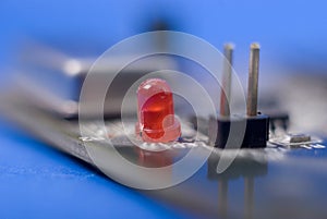 Single red diode on electronic circuit board