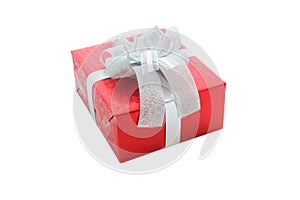 Single red gift box with silver ribbon isolated on white background