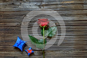 Single red rose with a Valentines gift