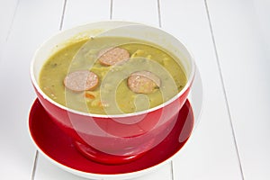 Single red soup bowl filled with Dutch soup