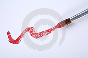 Single red stroke with paintbrush