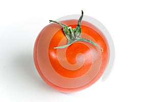 Single red tomato isolated on white