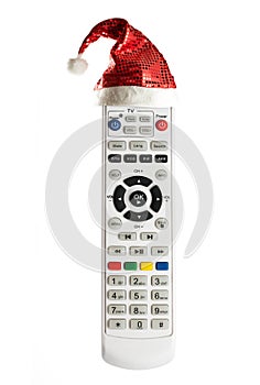 Single remote control with christmas hat isolated on white background