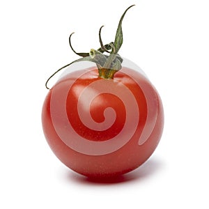 Single ripe cherry tomato close up isolated on white background