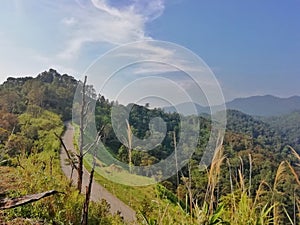 Single Road and Mountain range. Beautiful landscape in Thailand.