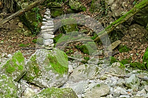 Single rock stack in a streambed, a pile of stacked rocks