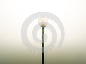 Single Round Lamp on a Black Pole