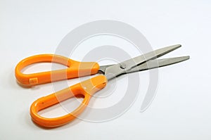 Single scissor with orange handle. Stationary
