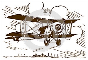 Single-seat rotary-engined racing biplane flying over trees and hangars near an airfield. llustration after a lithography from the photo