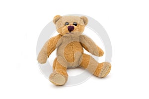 Single sitting teddy bear over white