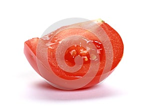 Single slice of juicy red tomato isolated on a white background