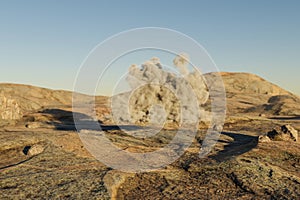 single small cloud in large desert environment with sand dunes, hills and rocks laying arround climate change heat concept 3D