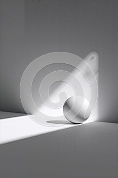 Minimalist Sphere with Sharp Shadow and Ample Negative Space