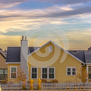 Single storey home with picket fence in Daybreak