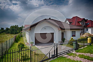 Single storey private house wide angle image, hdr colors, outside view with garden in summer